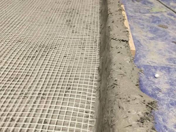 Fiberglass mesh for concrete reinforcement.